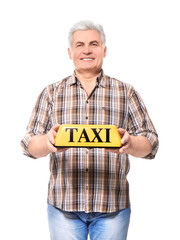 Senior driver with taxi roof light on white background