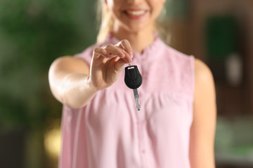 Young woman with car key, closeup