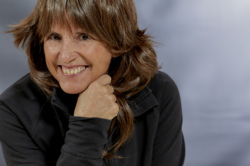 Attractive Woman with Brown Hair with Chin on her Hand