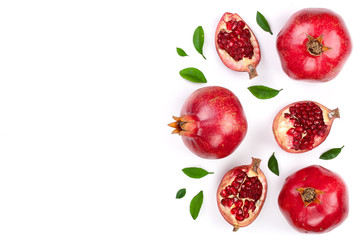 pomegranate with leaves isolated on white background with copy space for your text. Top view. Flat lay pattern