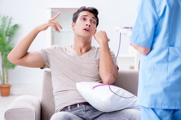 Patient getting blood transfusion in hospital clinic