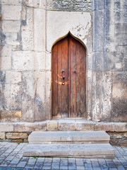 Asian style ancient wooden door in Baku old town