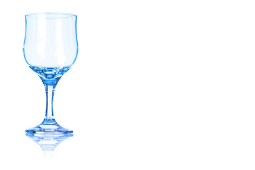 An empty white wine glass toned in blue color.