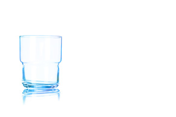 An empty glass for whiskey toned in blue color.