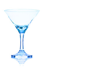 Empty the cocktail glass toned in blue color.