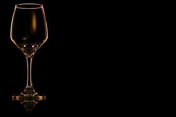 Empty glass for water or red wine with fire reflection.