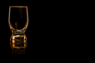 Fototapeta na wymiar An empty glass of water with fire reflection.