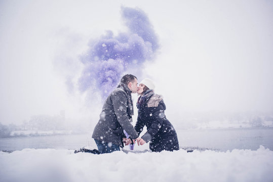 Girl And Man In Snow Blue Smoke Bomb.