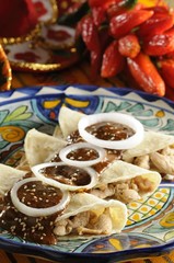 Corn tortillas stuffed with shredded chicken and battered with 