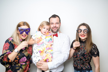 photo booth family dad mom daughter baby girl pose plain white background studio