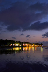 Night lights reflection after sunset at Kuta beach, Bali, Indonesia