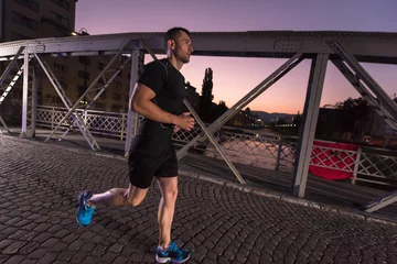 Photo sur Plexiglas Jogging man jogging across the bridge in the city