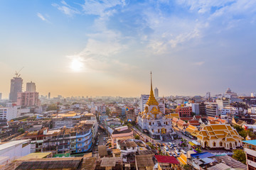 Fototapeta na wymiar aerial view sunset above Wat Traimit in Bangkok