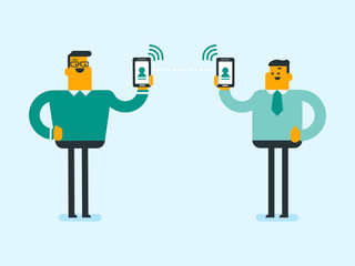Two young smiling caucasian white businessmen holding mobile phones and exchanging information via smartphones