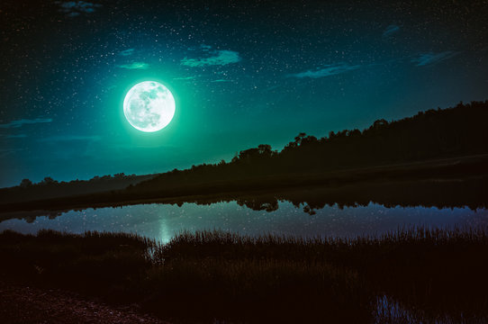 Night sky with full moon and many stars, serenity nature background.