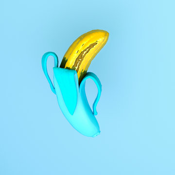 Unwrapped gold banana on a blue background, 3d rendering. 3d illustration.