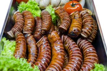 Appetizing pork sausages toasted on fire