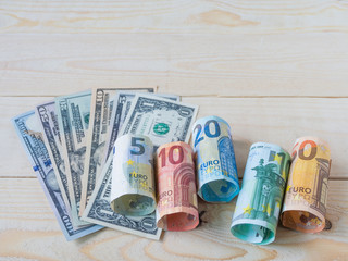 euro and dollar currency on wood table