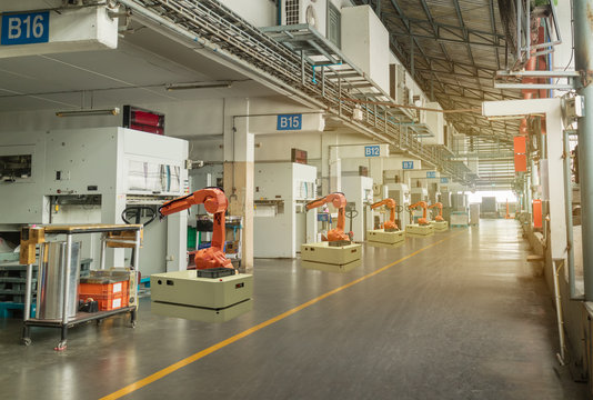 iot smart industry 4.0 concept. Automation robotic arm working in operation machine zone in factory, Robot using in industrial manufacturing for precision, Repetition, intense labor,more productivity