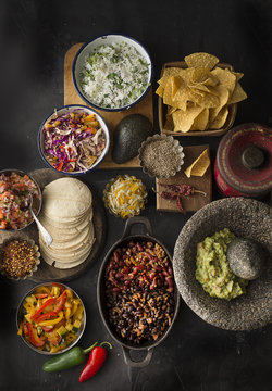 Overhead view of Mexican food on slate background