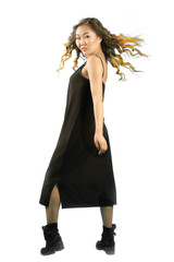 Fototapeta premium young elegant asian woman standing back and turning forvard, looking at the camera.