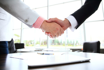 Business people shaking hands, finishing up a meeting.
