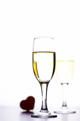 glass of white wine on a table on white background isolate
