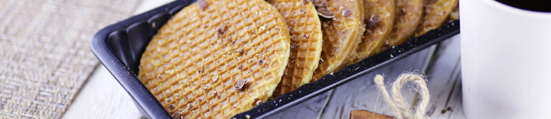 Horizontal panorama bakground of viennese wafers with caramel