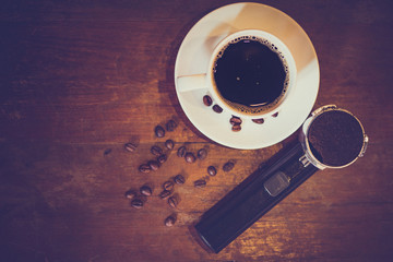 Vintage coffee style set with coffee grains on the black floor