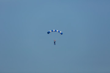 parachute./Under the clouds.