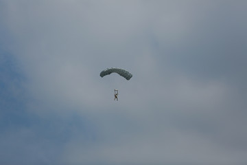 parachute./Under the clouds.