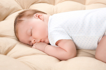 Obraz na płótnie Canvas Cute newborn baby sleeping on lounge at home
