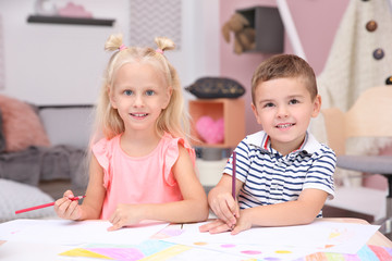 Fototapeta premium Cute little children drawing at home