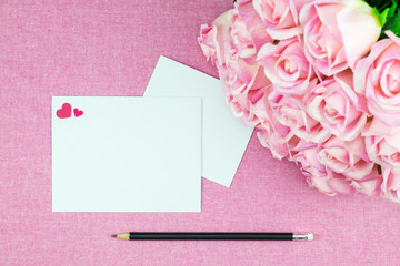 decoration Romantic, St valentine's day concept, Top view of flat lay with valentines mini pin heart with pink rose flower on pink background with copy space minimal style.