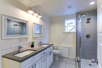 White bathroom vanity with granite top