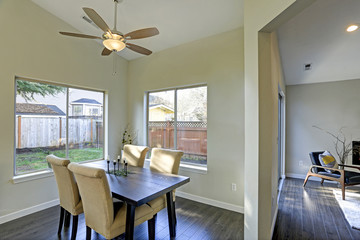 Dining room interior with backyard view.