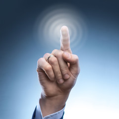 hand of a man presses the button on the virtual screen