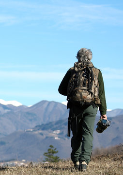 Man walking over the mountains