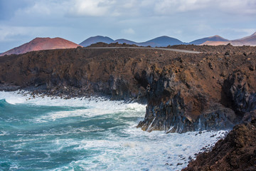 Fototapeta na wymiar Volcanic coastline near Los Hervideros lava caves in Lanzarote, Canary islands, Spain