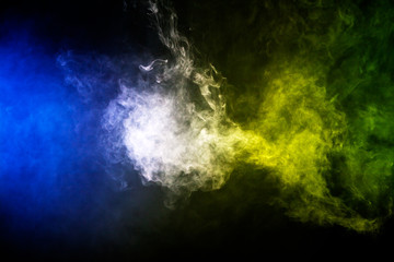 Colorful smoke clouds on dark background