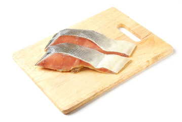 Salmon steak  on a wooden cutting board  