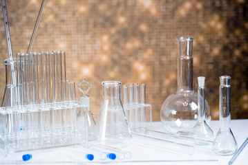 Microscope with lab glassware, science laboratory research concept