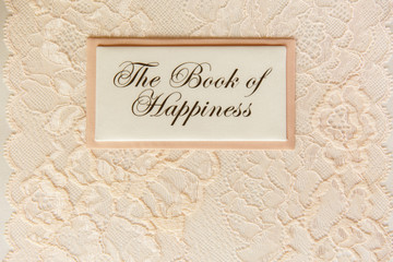 Wedding book for writing best wishes on wedding day. Album for marriage memories for bride and groom. Scrapbook with inscription ''The Book of Happiness''