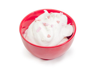 Dessert made of beaten egg whites with hearts confectionery strew