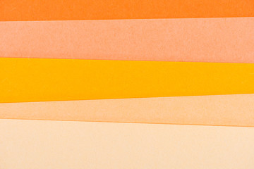 close-up shot of orange shades paper layers for background