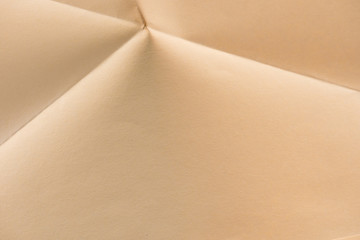 close-up shot of folded biege color paper