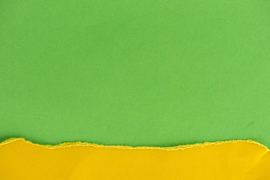 close-up shot of green and yellow paper layers for background