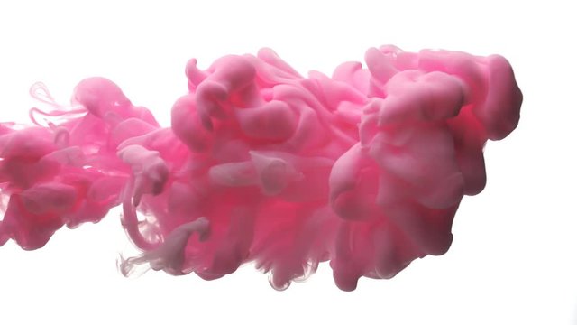 Pink ink dropped in water on white background
