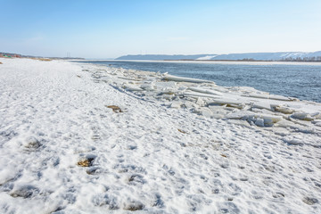 The gathering of ice from the river in early spring