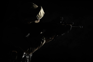 The man in the image of a member of the SWAT police with weapons